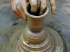 Moulding clay into a pot