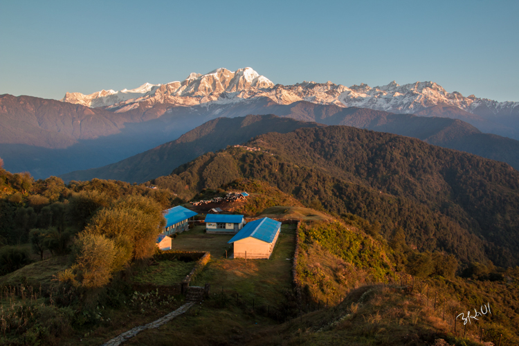 Lamjung Himal and a primary school in the foreground.